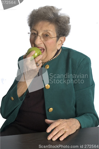 Image of woman eating an apple