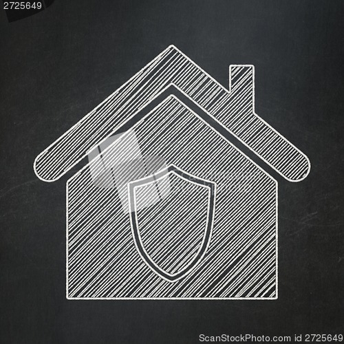 Image of Finance concept: Home on chalkboard background