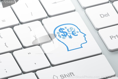 Image of Marketing concept: Head With Finance Symbol on computer keyboard background