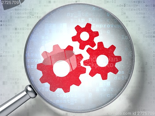 Image of Marketing concept: Gears with optical glass on digital background