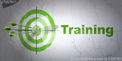 Image of Education concept: target and Training on wall background