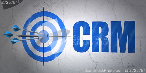 Image of Business concept: target and CRM on wall background