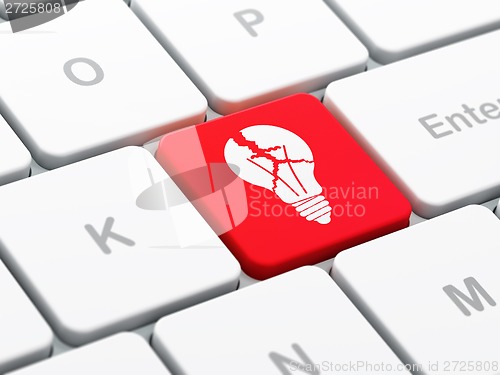 Image of Finance concept: Light Bulb on computer keyboard background