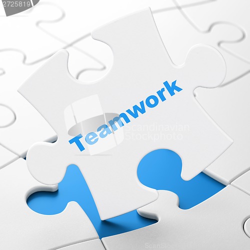 Image of Business concept: Teamwork on puzzle background