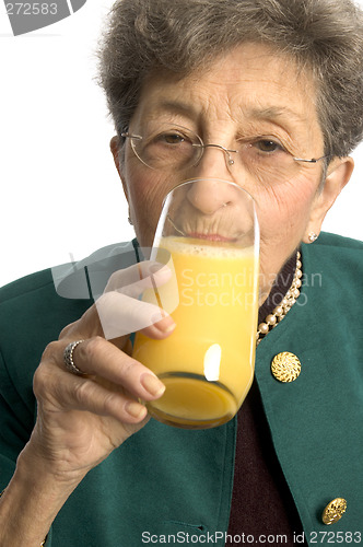 Image of woman drinking orange juice