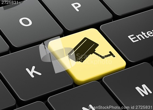 Image of Security concept: Cctv Camera on computer keyboard background
