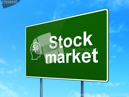 Image of Stock Market and Head With Finance Symbol on road sign background