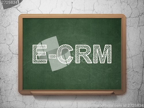 Image of Business concept: E-CRM on chalkboard background