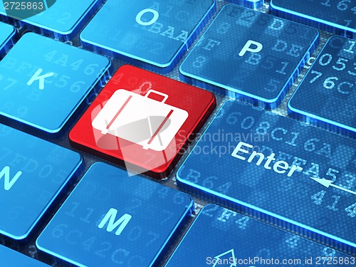 Image of Travel concept: Bag on computer keyboard background