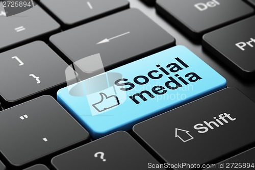 Image of Thumb Up and Social Media on computer keyboard background