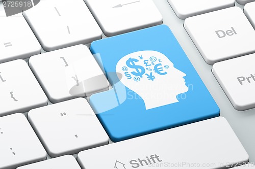 Image of Advertising concept: Head With Finance Symbol on computer keyboard background