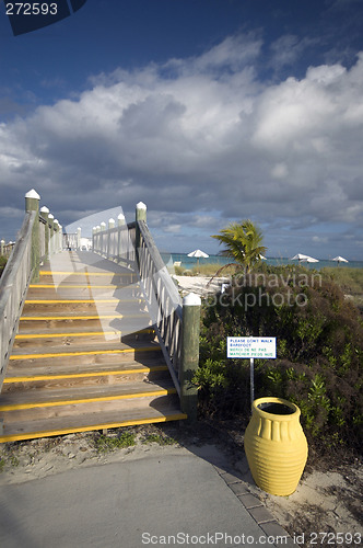 Image of boardwalk with yellow urn