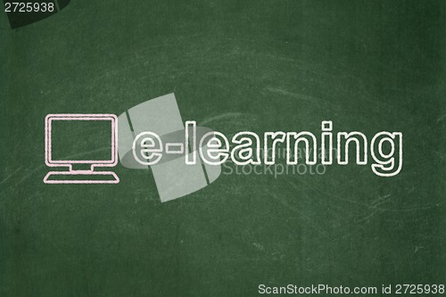 Image of Education concept: Computer Pc and E-learning on chalkboard background