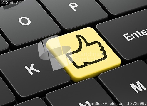 Image of Social network concept: Thumb Up on computer keyboard background