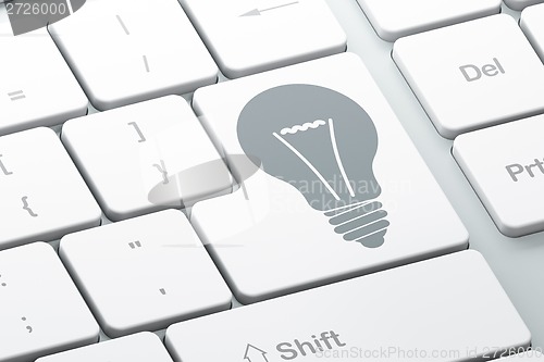 Image of Business concept: Light Bulb on computer keyboard background