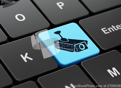 Image of Security concept: Cctv Camera on computer keyboard background