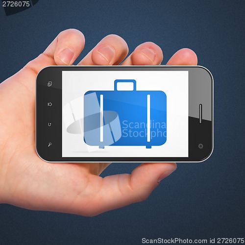 Image of Tourism concept: Bag on smartphone