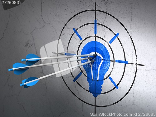 Image of Finance concept: arrows in Light Bulb target on wall background
