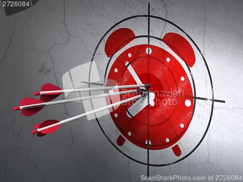 Image of Timeline concept: arrows in Alarm Clock target on wall background