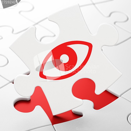 Image of Protection concept: Eye on puzzle background