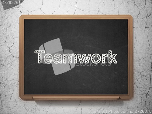 Image of Finance concept: Teamwork on chalkboard background