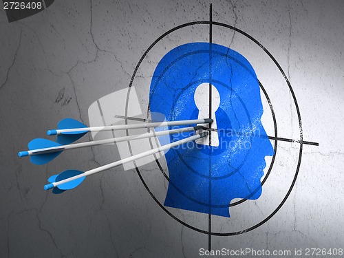 Image of Marketing concept: arrows in Head With Keyhole target on wall background