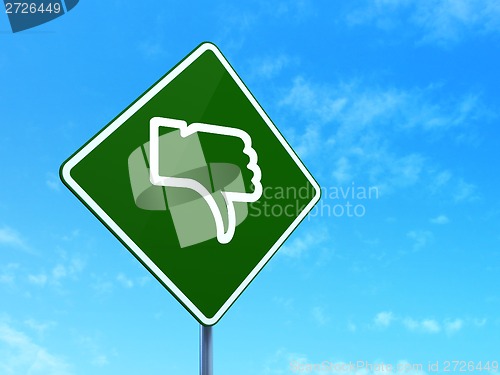 Image of Social network concept: Thumb Down on road sign background