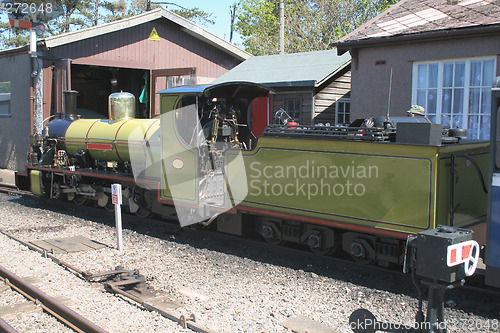 Image of green steam train