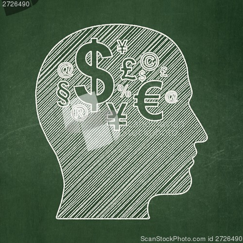 Image of Education concept: Head With Finance Symbol on chalkboard background