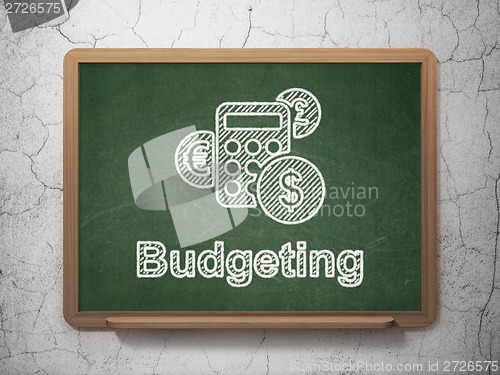 Image of Business concept: Calculator and Budgeting on chalkboard background