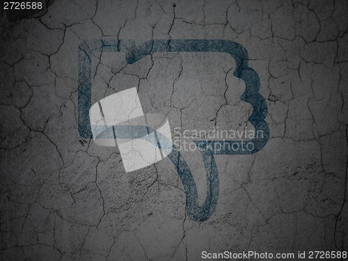 Image of Social network concept: Thumb Down on grunge wall background