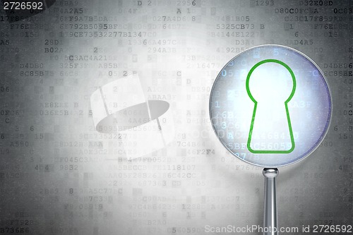 Image of Protection concept:  Keyhole with optical glass on digital background