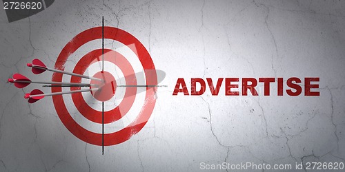 Image of Advertising concept: target and Advertise on wall background