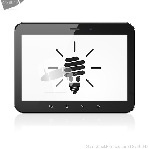 Image of Finance concept: Energy Saving Lamp on tablet pc computer