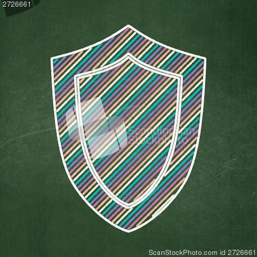 Image of Privacy concept: Shield on chalkboard background