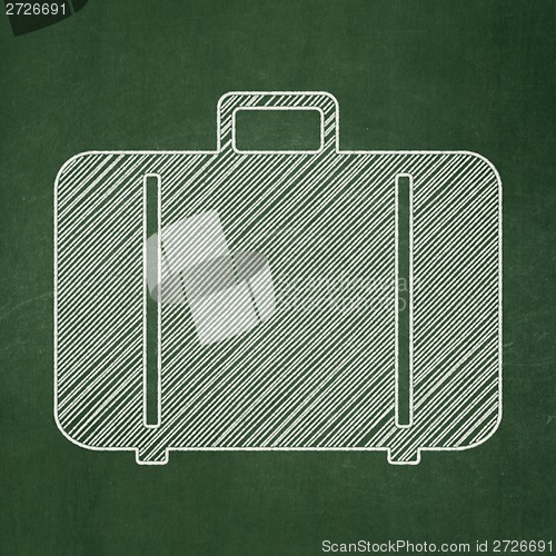 Image of Tourism concept: Bag on chalkboard background