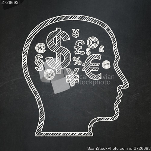 Image of Education concept: Head With Finance Symbol on chalkboard background