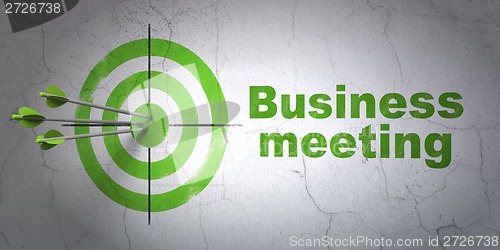 Image of Finance concept: target and Business Meeting on wall background