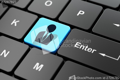 Image of Finance concept: Business Man on computer keyboard background
