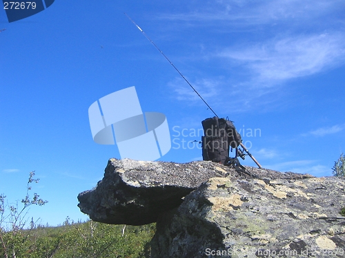 Image of Backpack and fishing rod