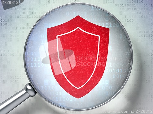 Image of Privacy concept: Shield with optical glass on digital background