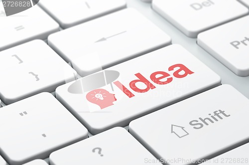 Image of Advertising concept: Head With Light Bulb and Idea on keyboard