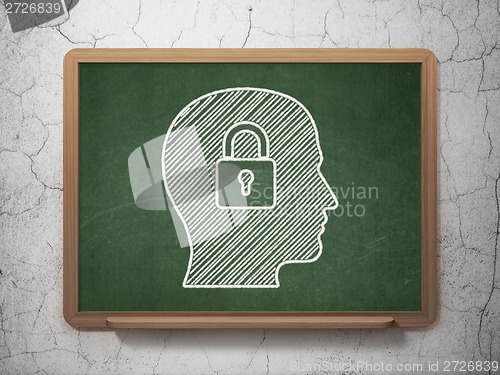 Image of Data concept: Head With Padlock on chalkboard background