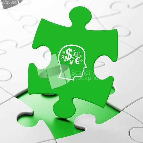 Image of Education concept: Head With Finance Symbol on puzzle background