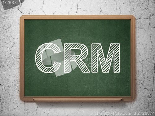 Image of Business concept: CRM on chalkboard background