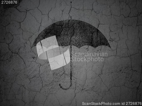Image of Privacy concept: Umbrella on grunge wall background