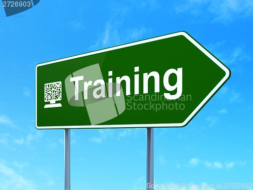 Image of Education concept: Training and Computer Pc on road sign background