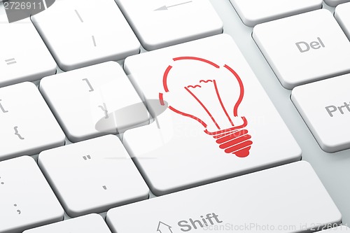 Image of Finance concept: Light Bulb on computer keyboard background