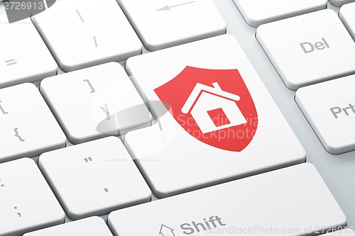 Image of Finance concept: Shield on computer keyboard background