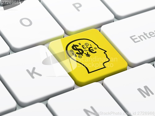 Image of Finance concept: Head With Symbol on computer keyboard background